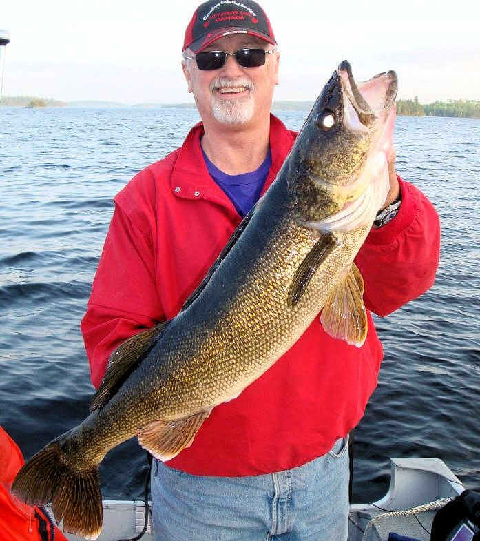 Garden Island Lodge American Plan angler displays giant trophy walleye.