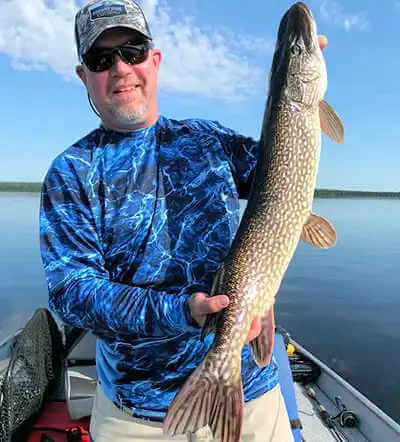 Garden Island Lodge American Plan angler displays nice northern pike. Garden Island Lodge American Plan angler displays nice northern pike