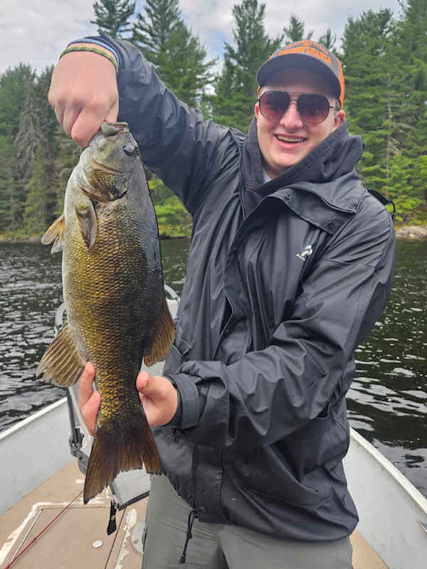 Garden Island guest holding nice smallmouth bass.