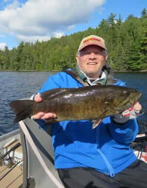 Garden Island guest holding nice smallmouth bass.