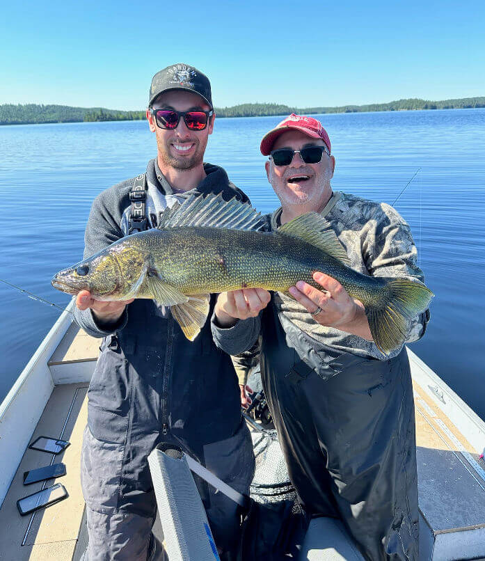 Angler and guide showing off nice walleye.