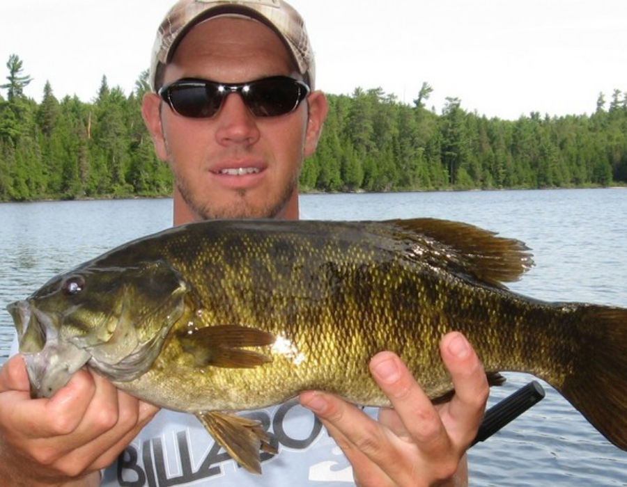 Angler showing off beautiful Lady Evelyn Lake smallmouth bass before releasing it.