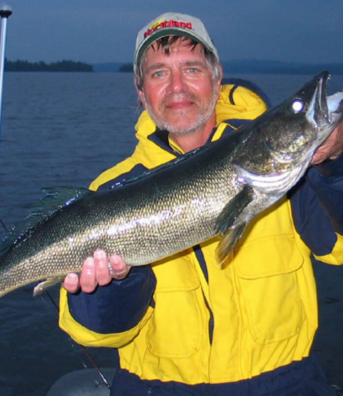 Fisherman showing off fat trophy Ontario walleye.