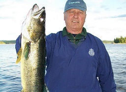 Garden Island angler holding up trophy Ontario walleye.