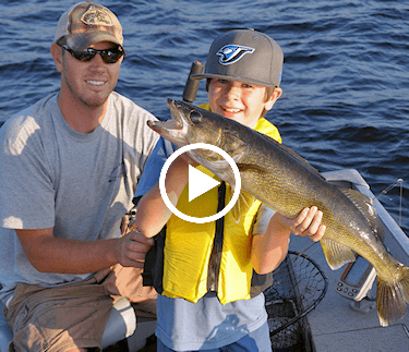 Young Man showing off big Ontario walleye.